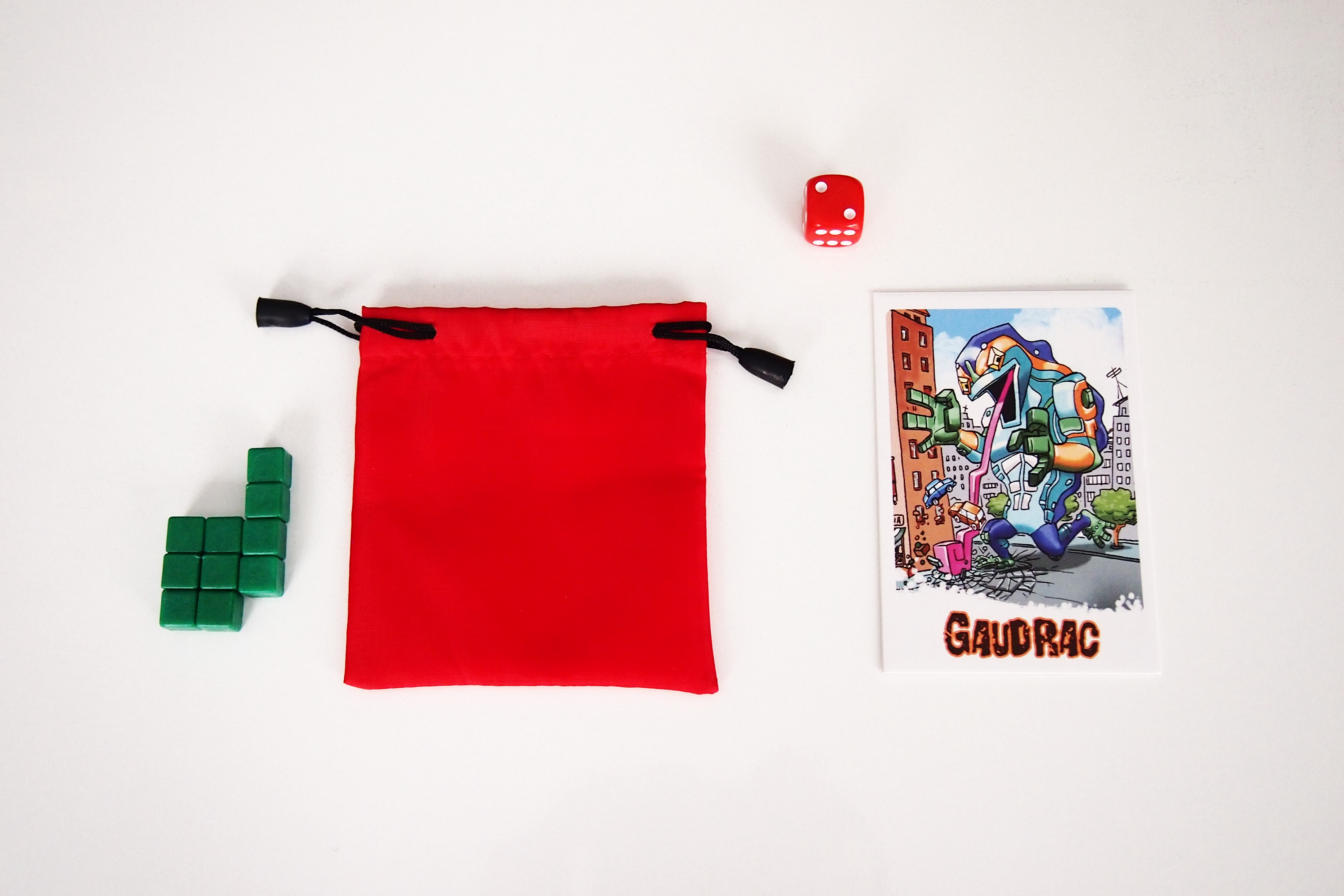 Cada jugador recibe una tarjeta de monstruo, el dado de su color y una bolsa con diez cubos. 
