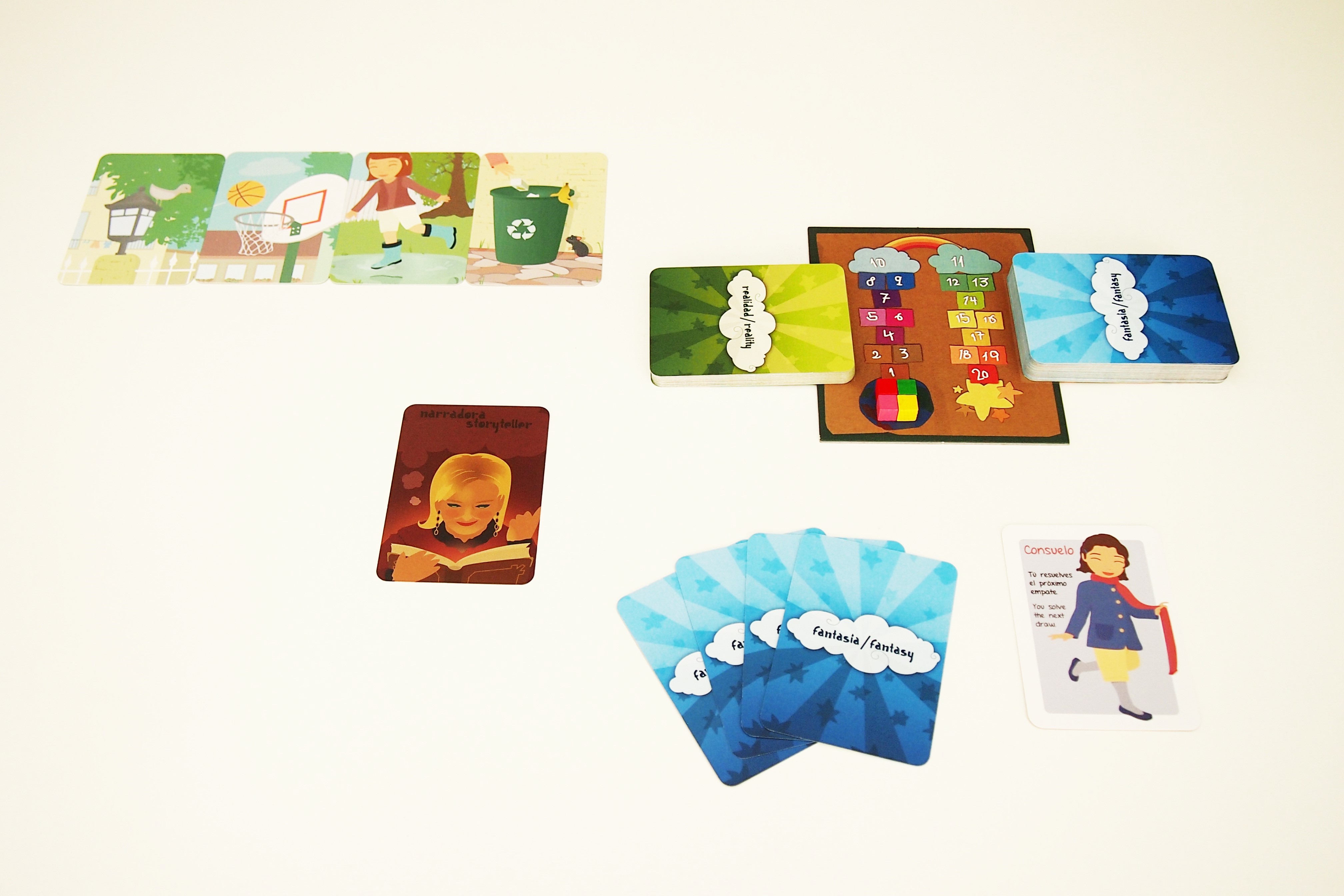 Preparación de la partida. Tras elegir al narrador inicial, se reparten cuatro cartas de fantasía y un personaje a cada jugador. 